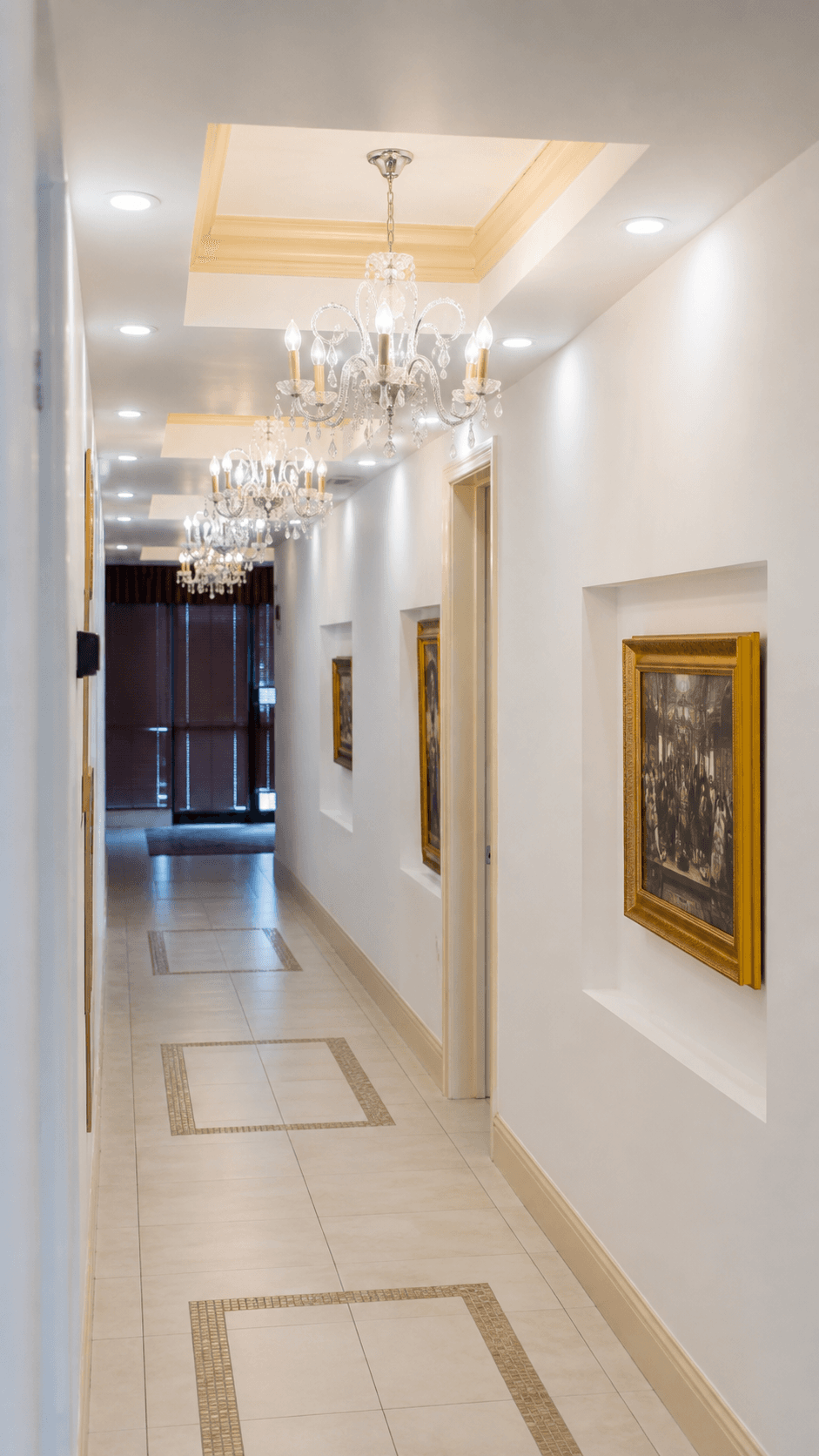A chandelier-lit hallway inside The Center for Regenerative Medicine